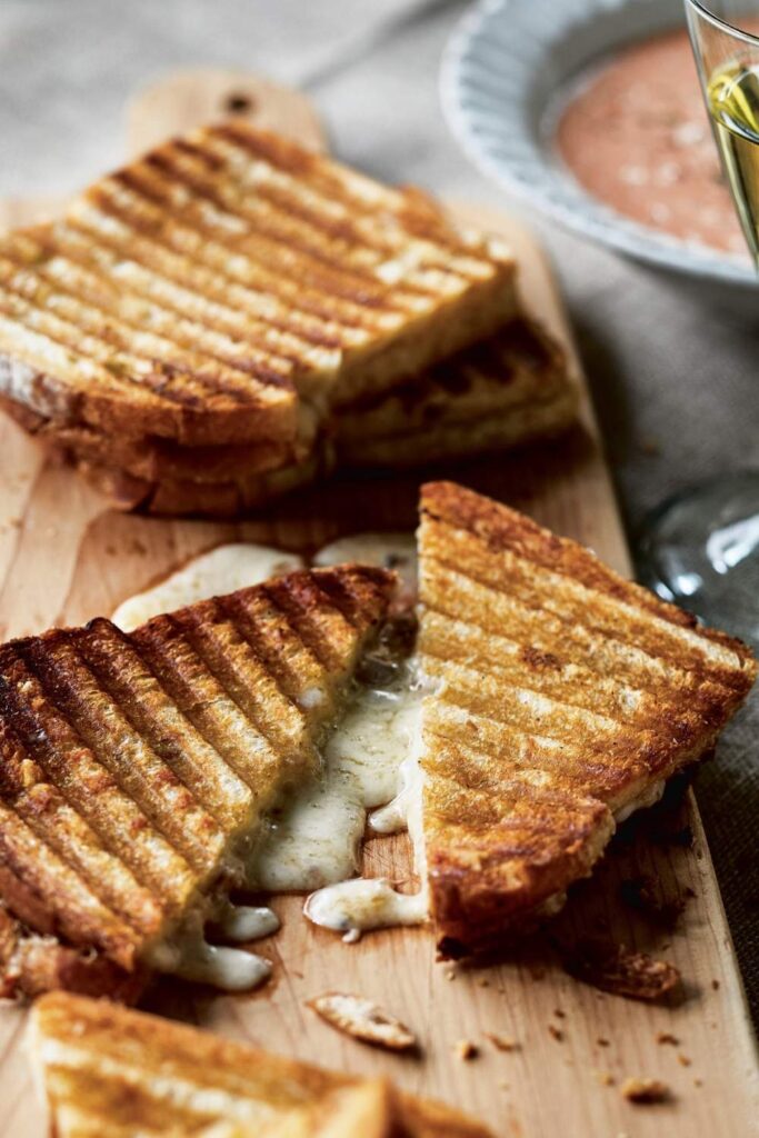 Heat a non-stick skillet over medium heat. Place the sandwiches in the skillet and cover with a lid. Cook for about 3-4 minutes per side, or until the bread is crispy and the cheese is melted.